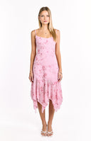 A soft pink midi-dress with thin spaghetti straps- featuring a floral print with beaded details and a flowing- handkerchief-style hemline. This dress is suitable for a summer event or a special occasion.