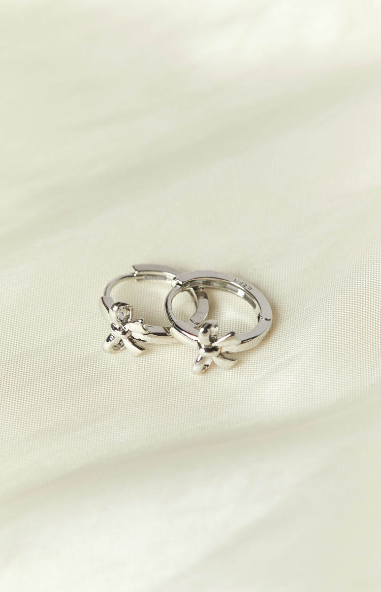 Darling Silver Bow Huggie Earrings (FREE over $120) Image