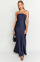 brunette model wearing a navy blue strapless dress