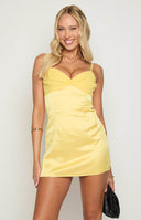 Honey yellow mini dress in satin material with bust ruffle detailing and spaghetti straps