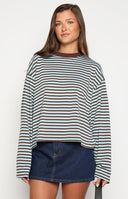 A person wearing a striped long-sleeved shirt