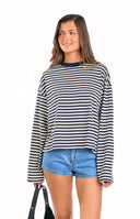Navy blue and white horizontal striped long-sleeve top with a mock neck