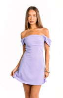 A person wearing a lavender off-the-shoulder mini dress with a wrapped or ruched bodice.