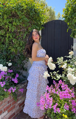 Fitted white strapless top with a delicate pink and green floral print