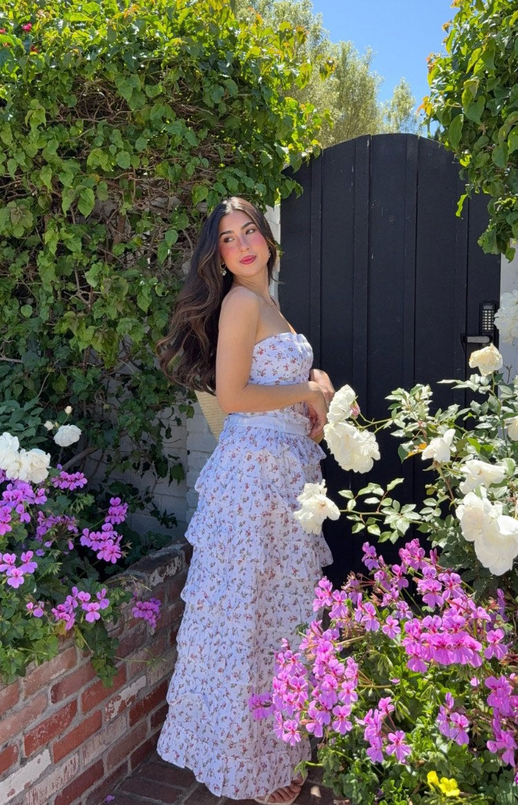 Fitted white strapless top with a delicate pink and green floral print