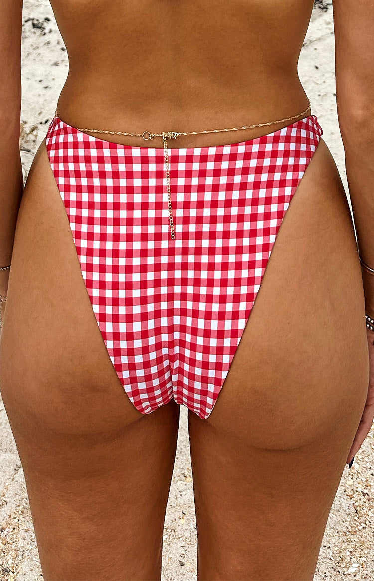 Rear view of red and white gingham bikini bottoms with a high-cut leg and cheeky coverage