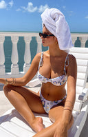 White Italia print high-cut bikini bottoms with V-front, worn with a matching balconette top