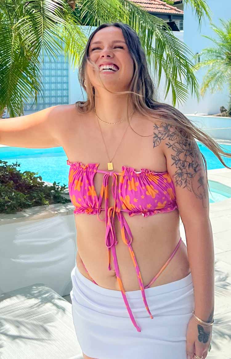 Strapless fuchsia and orange floral bikini top with ruched edges and front tie detail