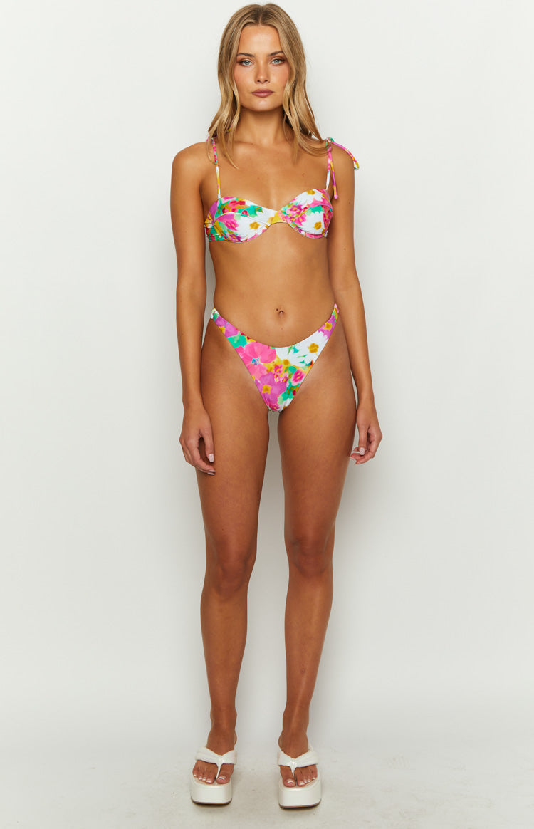 White floral print bikini top with underwire cups and tie-shoulder straps, showing matching high-cut bottoms