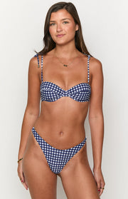 Front view of navy gingham bikini bottoms with a high-cut leg and V-front waist