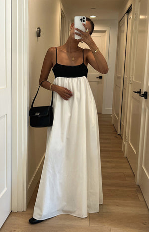 Beginning Boutique Akari White Contrast Maxi Dress black fitted knit bodice with thin spaghetti straps and a white gathered maxi skirt