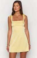 Beginning Boutique Akira Yellow Tie Mini Dress yellow satin straight neck mini with tie shoulders and fitted bodice