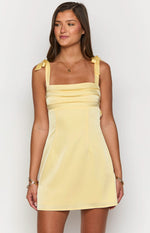 Yellow mini dress with square neckline, tie shoulders, and pleated bodice detail