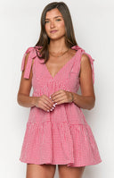 Beginning Boutique Angel Girl Red Gingham Mini Dress red gingham V-neck mini dress with tie shoulders and a tiered babydoll skirt