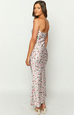 Side view of the white floral strapless maxi dress, fitted through the body with a slight flare at the hem