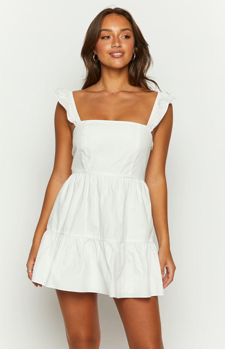 White mini dress with a square neckline, ruffled straps, and a tiered gathered skirt