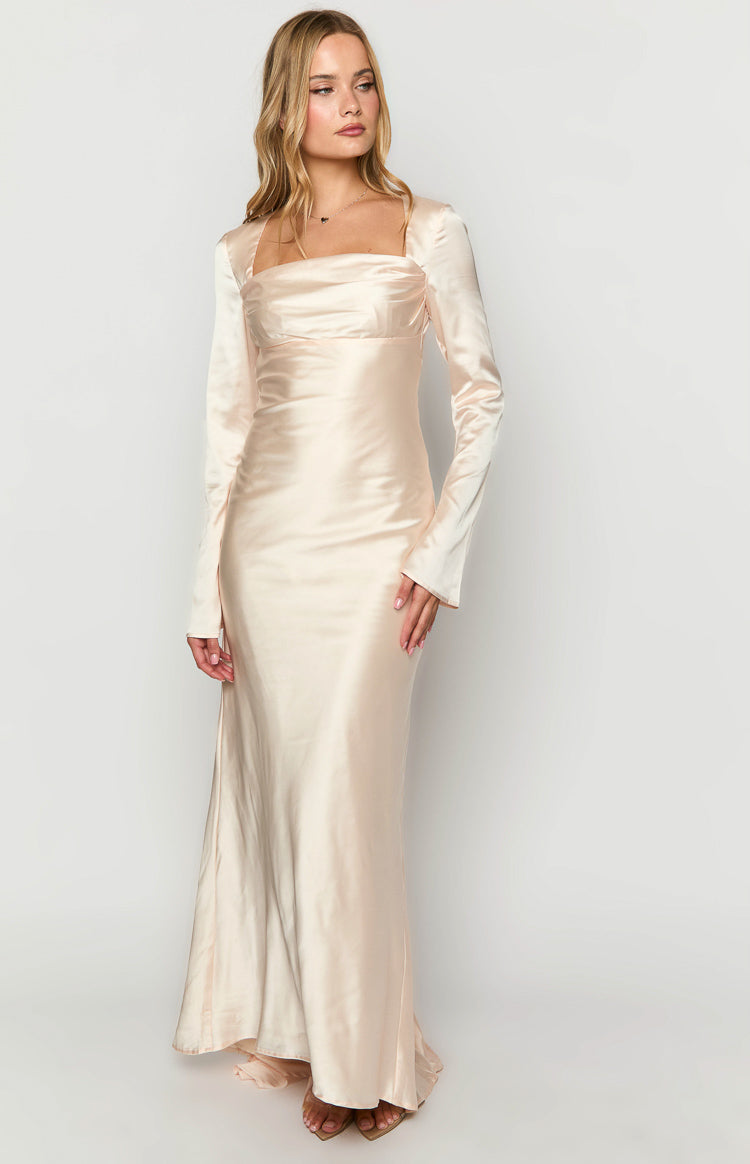 Full length front view of a cream satin maxi dress with a square neckline and long sleeves