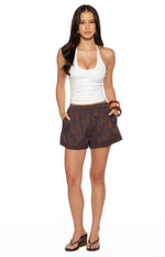 Front view of brown shorts with a subtle blue floral pattern, elasticated waist, and relaxed fit