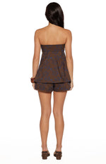 Rear view of the brown strapless longline top with a straight back and blue floral print