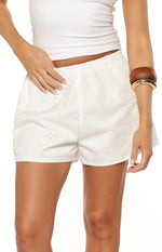 Beginning Boutique Ailany White Floral Shorts white cotton shorts with elasticated waist, floral broderie anglaise, and scalloped hem