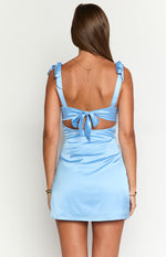 Back view of a blue satin mini dress showing the tie-up shoulder straps, waist tie, and back cutouts