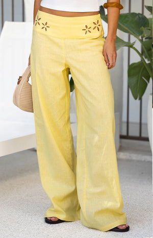 Beginning Boutique Alamara Yellow Floral Detail Wide Leg Pants yellow wide leg pants with floral cutouts on the waist