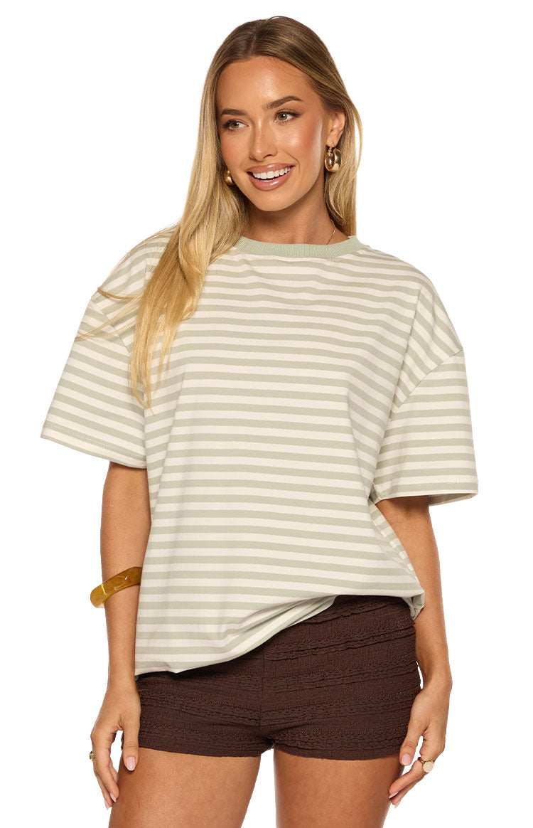 Ribbed sage green crew neck and wide short sleeves of an oversized striped tee