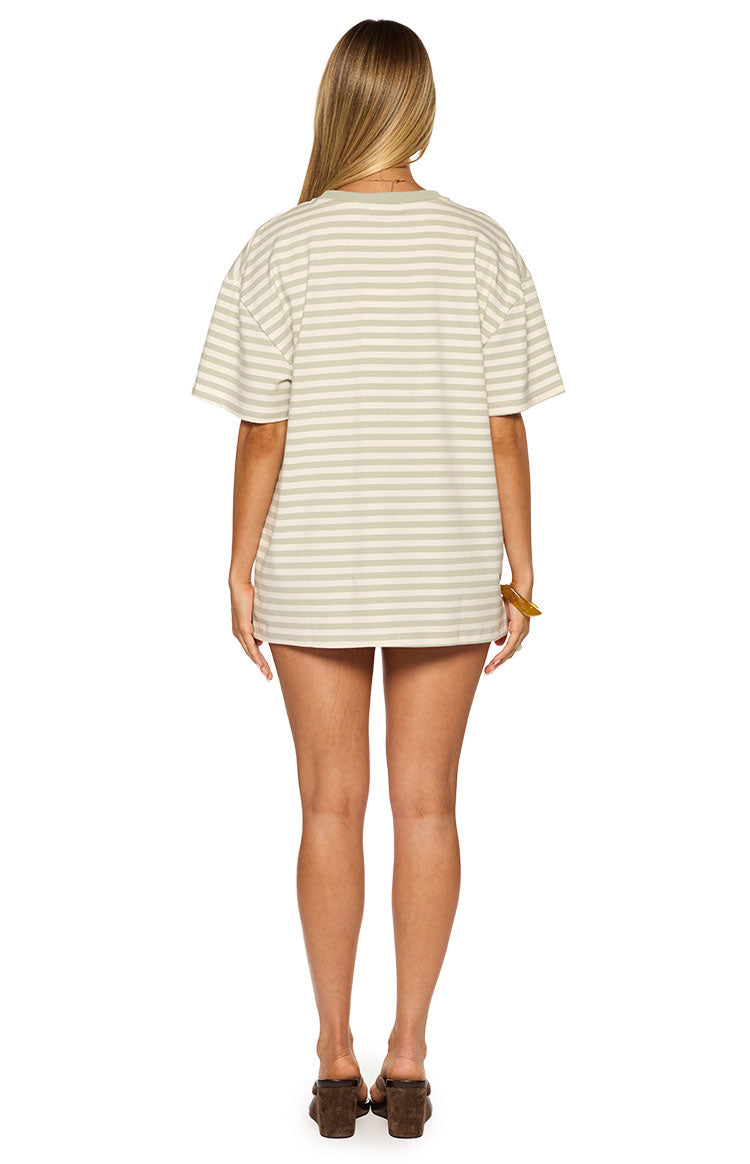 Rear view of the sage green and off-white striped oversized tee with short sleeves and a solid sage crew neck trim