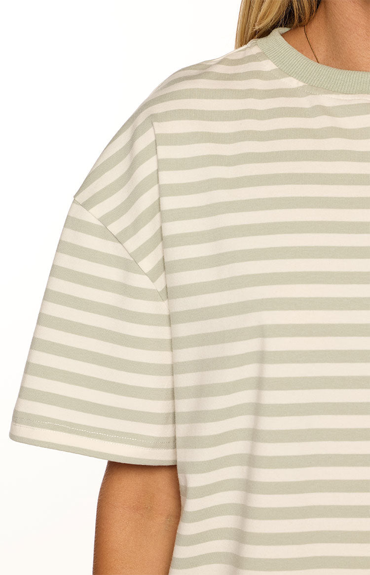 Detail shot of the sage stripe tee's ribbed crew neck and dropped shoulder short sleeve