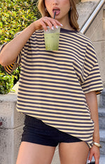Front view of a yellow and black striped oversized tee with a relaxed fit and wide short sleeves