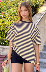 Front view of the yellow and black striped oversized tee with wide, short sleeves and a relaxed drape