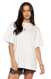 Front view of a white oversized tee with a classic crew neck and wide short sleeves