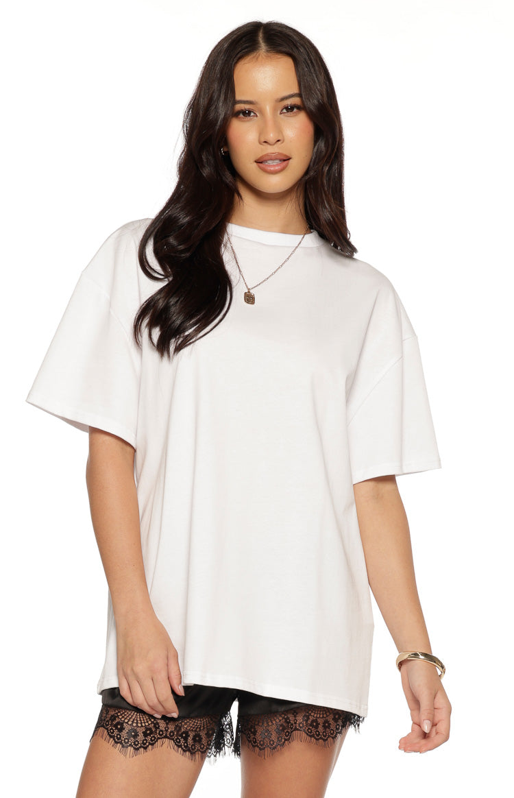 Front view of a white oversized tee with a classic crew neck and wide short sleeves