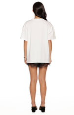 Rear view of the white oversized short sleeve tee with a relaxed fit and straight hem