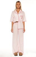 A close up of the Alexea Pink Stripe Pajama Pants showing the relaxed fit and soft fabric perfect for a luxurious night in.
