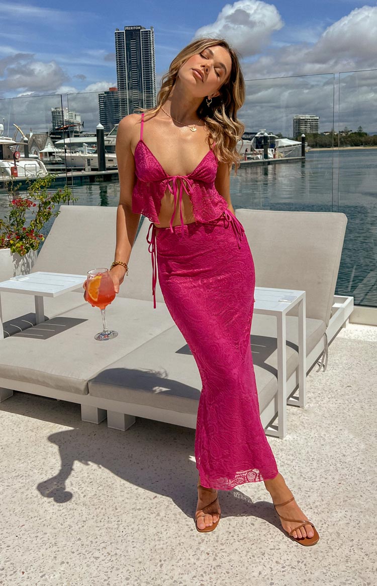 Beginning Boutique Alexia Fuschia Lace Tie Up Maxi Skirt fuschia lace bodycon maxi skirt with tie-up sides and sheer overlay