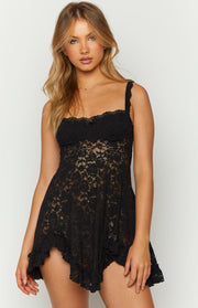 Black floral lace mini dress with a square neckline, delicate bust bow, and ruffled asymmetrical hem