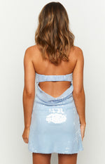 Rear view of a blue sequin mini dress with a low cowl back and a shirred elastic band