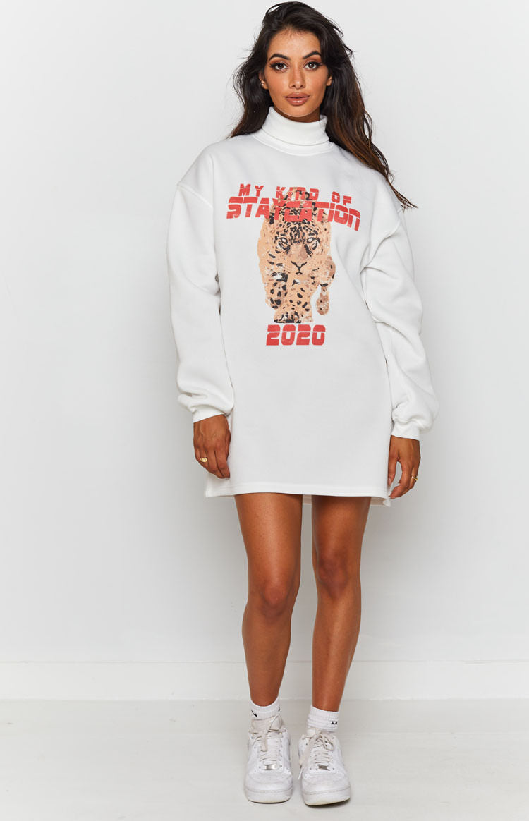 White turtleneck mini dress with a large leopard graphic and red "MY KIND OF STAYCATION 2020" print