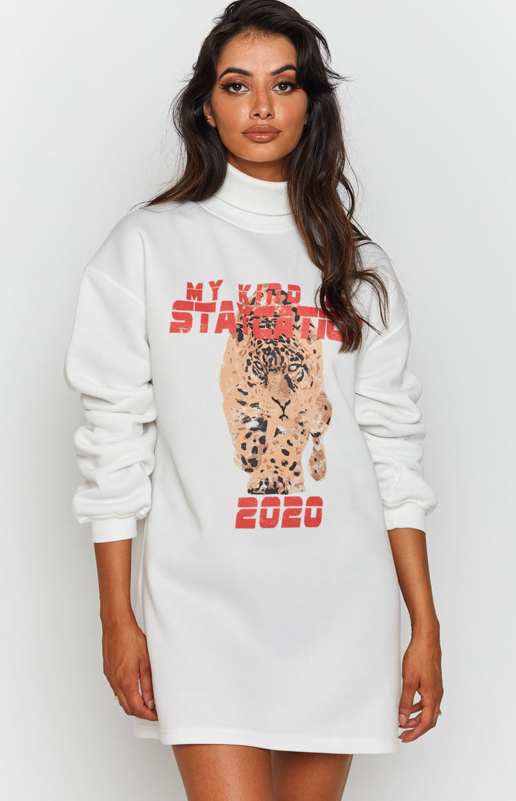 White All or Nothing Dress, a relaxed fit sweatshirt dress with a high roll neck and a bold leopard graphic print