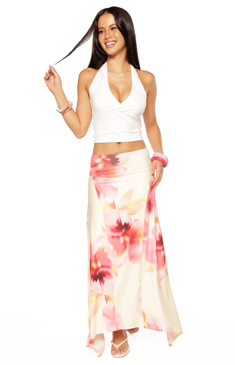Cream maxi skirt with large pink and yellow floral print and a hanky hem