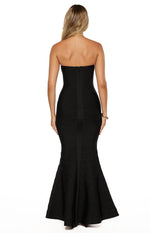 Rear view of a black strapless bandage maxi dress with a full-length zipper and flared mermaid hem