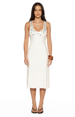 Front view of a white scoop neck midi dress with decorative silver button details on the neckline and straps