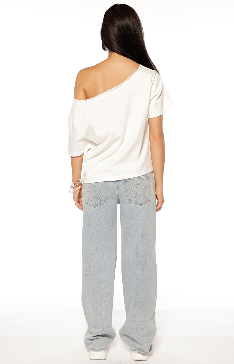 Back view of a white oversized tee with an off-shoulder neckline, short sleeves, and a relaxed fit