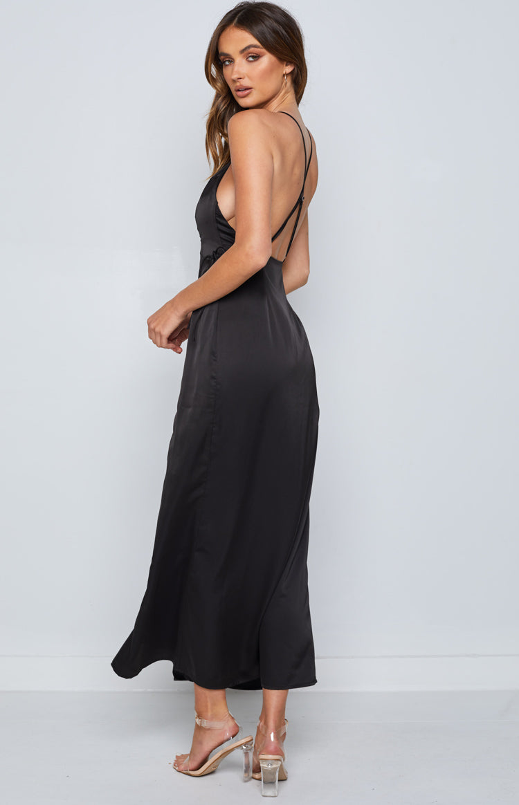 Close-up of the black satin maxi dress showing the halter neckline with a keyhole cutout at the bust