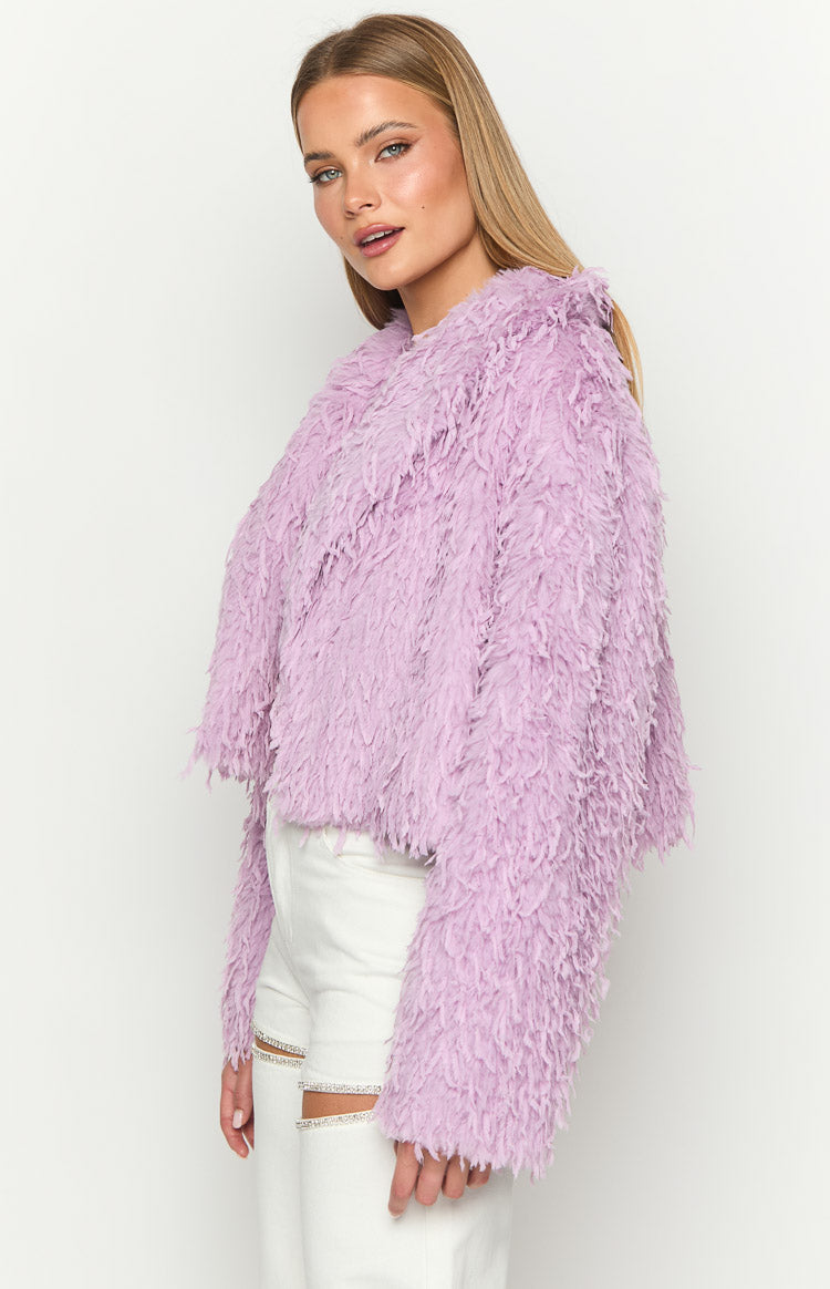 Side view of a cropped purple shaggy fringe jacket with long sleeves