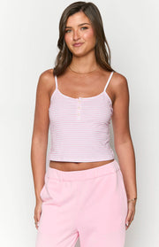Front view of a pink and white striped singlet with thin spaghetti straps and a three-button placket