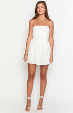 White strapless mini dress with a ruched bodice and a subtle check pattern