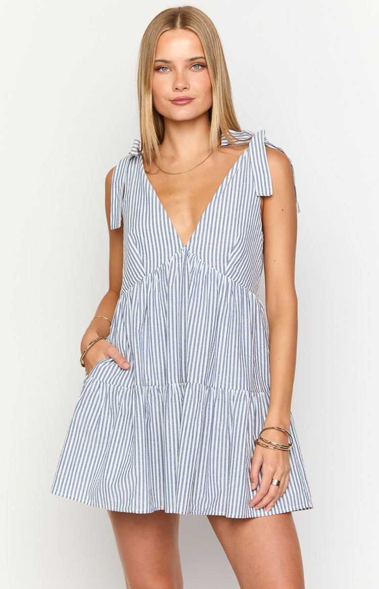 Blue and white striped mini dress with a deep V-neck, tie-up shoulder straps, and a tiered skirt with side pockets
