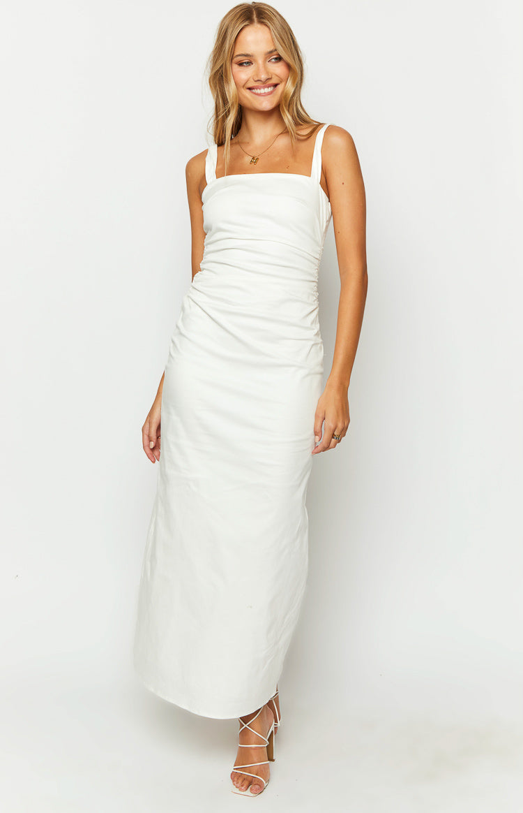 White maxi dress with a square neckline, thick straps, and side ruching on the fitted bodice